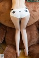 A woman in a white panties with a panda face on it.