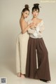 A couple of women standing next to each other.